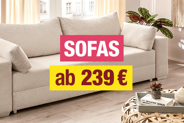 Beiges Sofa mit Kissen in hellem Wohnzimmer, Text 'SOFAS ab 239 €'
